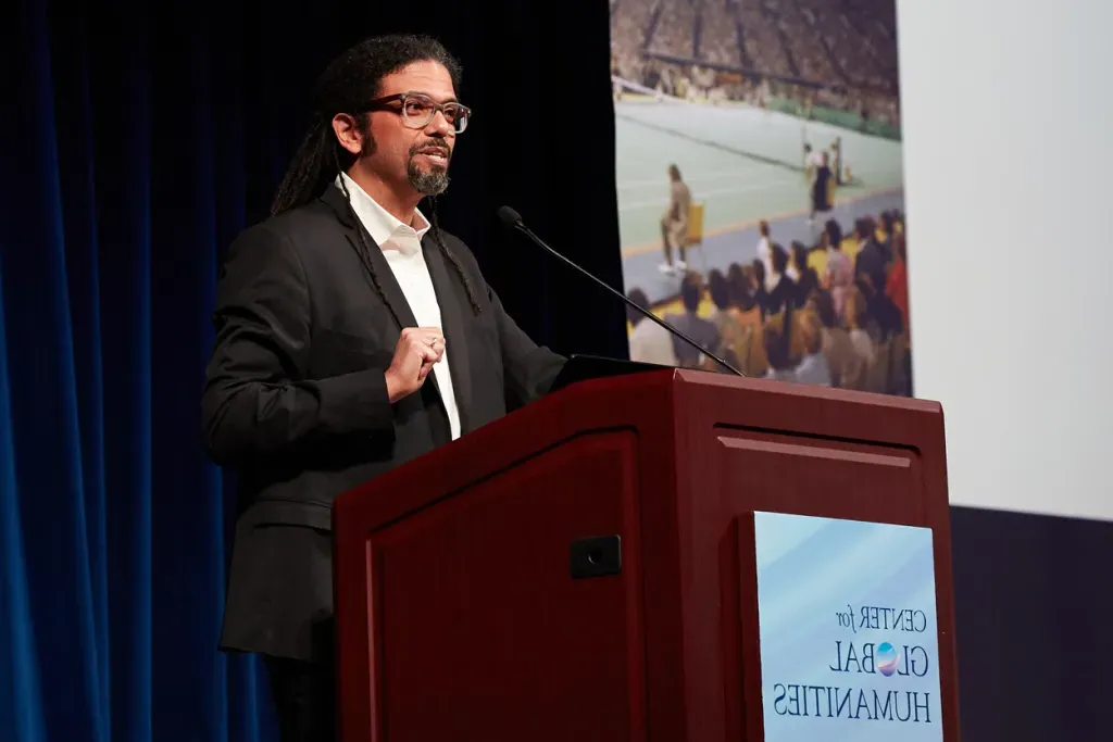 A Center for Global Humanities lecture speaker standing at podium